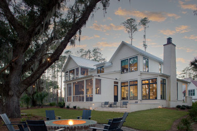 Transitional white two-story concrete fiberboard and clapboard exterior home photo in Charleston with a metal roof