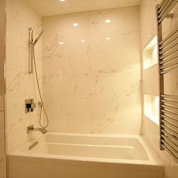 Modern Soaking Bathtub with Marble Tile Wall and Chrome Fixtures