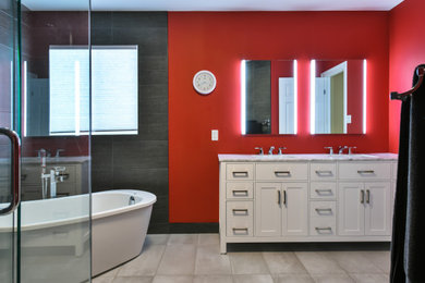 This is an example of a mid-sized modern master bathroom in Other with flat-panel cabinets, white cabinets, a freestanding tub, a corner shower, gray tile, stone slab, red walls, ceramic floors, a drop-in sink, engineered quartz benchtops, white floor, a hinged shower door, white benchtops, a niche, a double vanity, a built-in vanity and panelled walls.