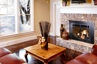 Design ideas for a living room in New York with a stone fireplace surround.