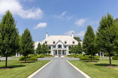 Inspiration for a huge coastal white exterior home remodel in Milwaukee