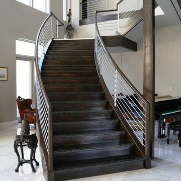 Custom stained wood and painted steel balustrade.