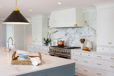 Inspiration for a huge transitional l-shaped medium tone wood floor open concept kitchen remodel in Philadelphia with flat-panel cabinets, marble backsplash, paneled appliances and an island