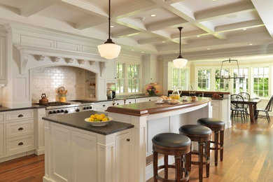 Inspiration for a large timeless single-wall dark wood floor eat-in kitchen remodel in Boston with a drop-in sink, shaker cabinets, white cabinets, marble countertops, gray backsplash, ceramic backsplash, stainless steel appliances and an island