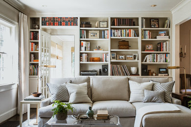 Living room library - large transitional brown floor living room library idea in Atlanta with beige walls