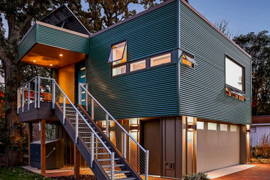 Small trendy green two-story metal exterior home photo in Minneapolis