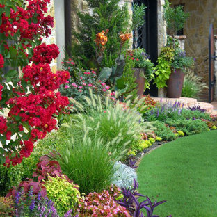 This is an example of a traditional front yard full sun garden for summer in Oklahoma City.