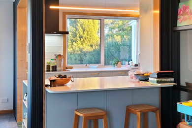 Photo of a contemporary home bar in Hobart.