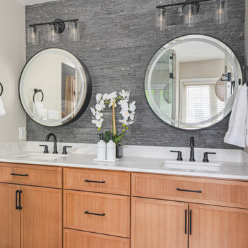 Bathroom Remodel in Sterling, VA Tub, glass shower, double vanity, stone wall