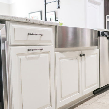 White Raised-Panel Cabinets with Mixed Hardware and Beverage Fridge