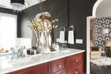 Bathroom - mid-sized transitional master black and white tile and porcelain tile marble floor bathroom idea in Chicago with beaded inset cabinets, medium tone wood cabinets, a one-piece toilet, black walls, an undermount sink and marble countertops