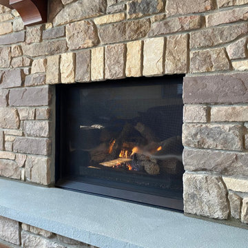 Pre Fab Fireplace Extraction. Replaced With Gas Fireplace With Custom Stone.
