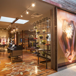 Antique Red Barnwood Paneling and Reclaimed Wood Flooring in a Modern Retail Store - Wall Panels