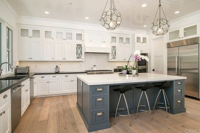 Example of a beach style home design design in Orange County