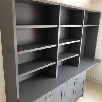 Fitted bookcase with cabinets and integrated desk