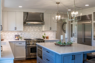 Inspiration for a mid-sized transitional eat-in kitchen in Chicago with an undermount sink, flat-panel cabinets, white cabinets, quartzite benchtops, white splashback, marble splashback, stainless steel appliances, light hardwood floors, with island, beige floor and white benchtop.