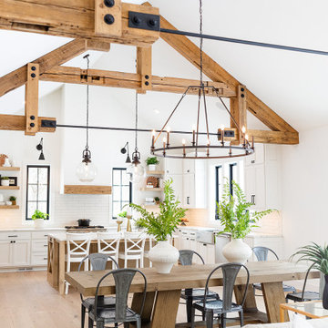 Weathered Antique Cathedral Ceiling Timber Trusses in a Farmhouse Dining Room