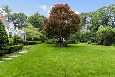 Photo of an expansive traditional backyard garden in Boston.