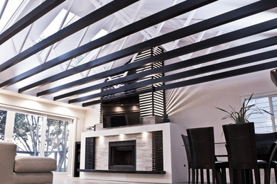 Trendy open concept porcelain tile living room photo in San Diego with a wall-mounted tv