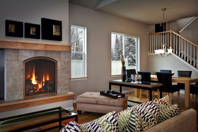Mid-sized eclectic formal and open concept medium tone wood floor living room photo in Other with brown walls, a standard fireplace and a stone fireplace