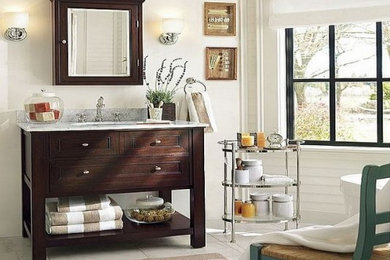 Large elegant master marble floor freestanding bathtub photo in DC Metro with beaded inset cabinets, dark wood cabinets, white walls, an undermount sink and marble countertops