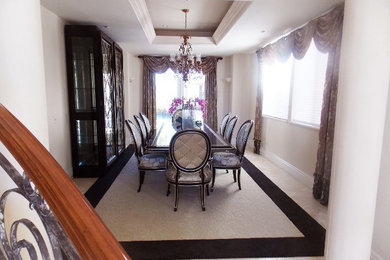 Mid-sized transitional carpeted enclosed dining room photo in Orange County with beige walls