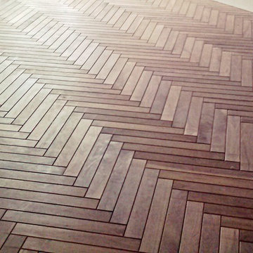 Beveled walnut solid hardwood in herringbone pattern
