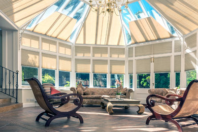 Photo of an expansive traditional sunroom in Hampshire.
