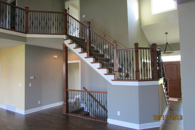 Staircase - large transitional curved staircase idea in Chicago