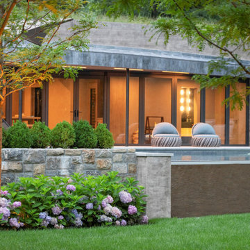 Vision Etched into the Hillside: A Sanctuary with Disappearing Sliding Glass Doo