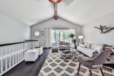 Family room - mid-sized transitional enclosed family room idea in Chicago with beige walls and a tv stand