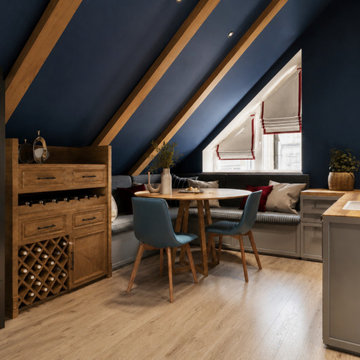 Navy Blue Attic Family Room with Exposed Wood Beams