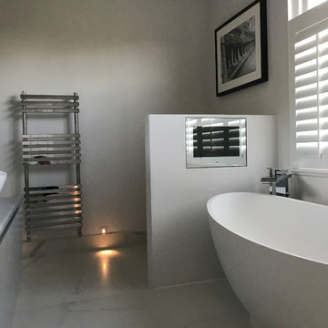 Luxurious large bathroom with TV in Putney