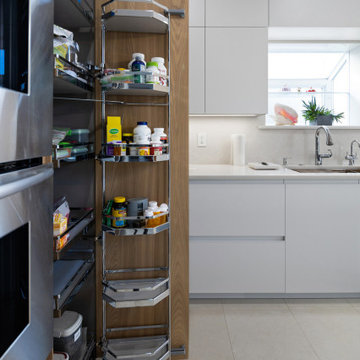 Handle-less european style kitchen in suburban Long Island, NY