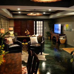 Photo of a large industrial walk-out basement in Atlanta with grey walls, concrete flooring and no fireplace.