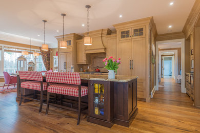 Eat-in kitchen - large traditional medium tone wood floor and brown floor eat-in kitchen idea in Other with ceramic backsplash, paneled appliances, an island and a farmhouse sink