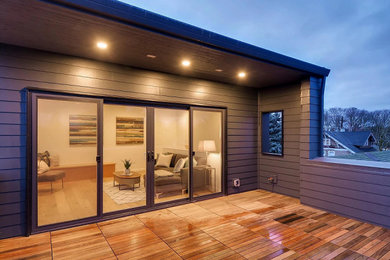 Example of a mid-sized minimalist rooftop deck design in Portland with no cover