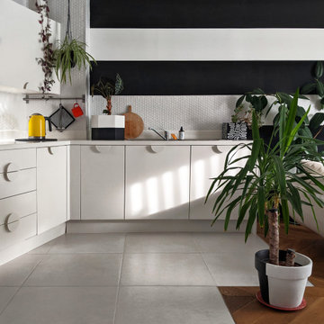 White Kitchen with Black and White Striped Wall