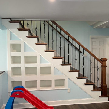 Accent Wall with Cut-Outs, Flooring, Stairway into Basement