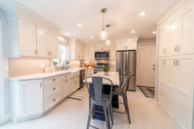 Small l-shaped porcelain tile and multicolored floor eat-in kitchen photo in Boston with a farmhouse sink, shaker cabinets, white cabinets, quartz countertops, gray backsplash, subway tile backsplash, stainless steel appliances, an island and white countertops