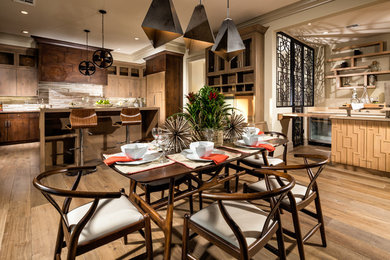 Example of a large trendy single-wall medium tone wood floor open concept kitchen design in Los Angeles with a drop-in sink, flat-panel cabinets, medium tone wood cabinets, wood countertops, beige backsplash, paneled appliances and an island
