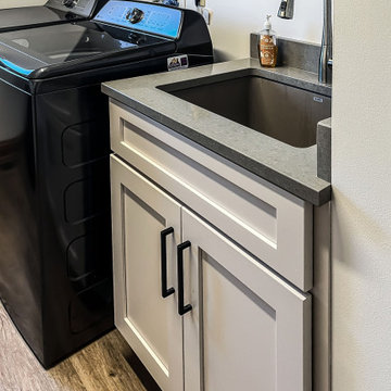 Laundry Room with Custom Cabinetry Quartz Countertop and Custom Floating Shelf