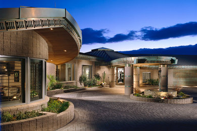 Huge contemporary gray one-story concrete exterior home idea in Phoenix