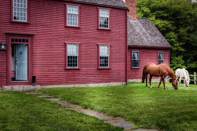 Example of a cottage exterior home design in Boston