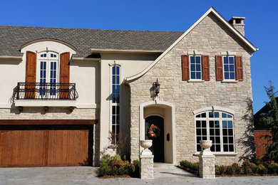 Example of a large tuscan two-story stone exterior home design in Oklahoma City