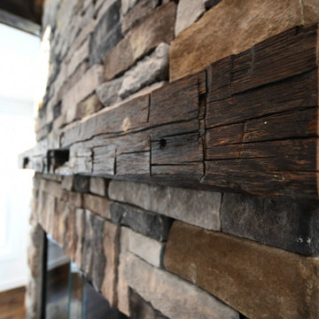 Stone and Reclaimed Wood Mantle Fireplace of Ranch 30 - Mid-Century Modern Count