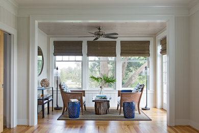 Design ideas for a mid-sized beach style sunroom in Charleston with medium hardwood floors.