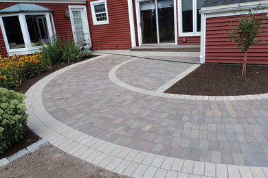 Inspiration for a mid-sized contemporary side yard concrete paver garden path in New York.