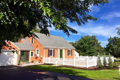 Photo of a small traditional full sun front yard concrete paver landscaping in Providence for summer.