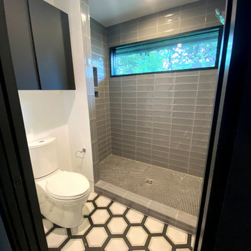 Modern Black and White Bathroom with Grey Shower